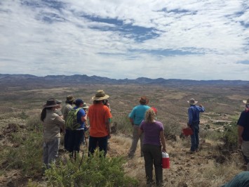 Dr. Hard discussing the site and the floodplain below to the crew (Shown in picture: Gabriella Zaragosa, Rosa Molina, Stephanie Dooley, Robert Gardner, Ian Bates, Kimberly Martin, Haley Fishbeck, Overton Lesley, Megan Brown, Dr. Robert Hard, and David Barron)